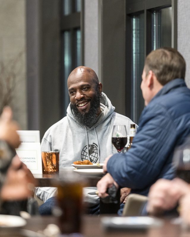 Bobby Cobb laughing with a guest at a Peachtree Corners Business Association Afterhours