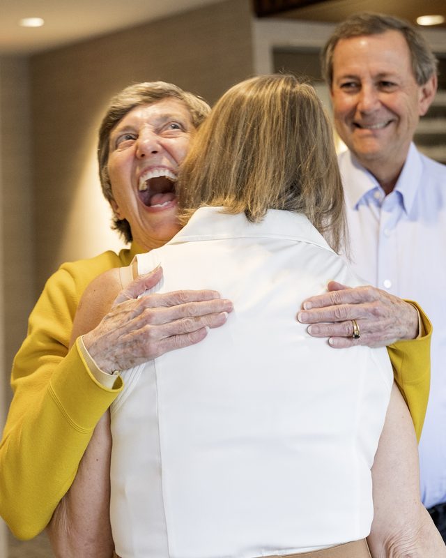 Guests embracing at the Beyond Checks and Halos book launch