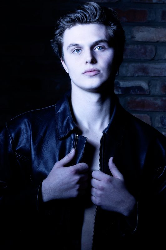 Model from The UGA Agency in leather, moody studio light