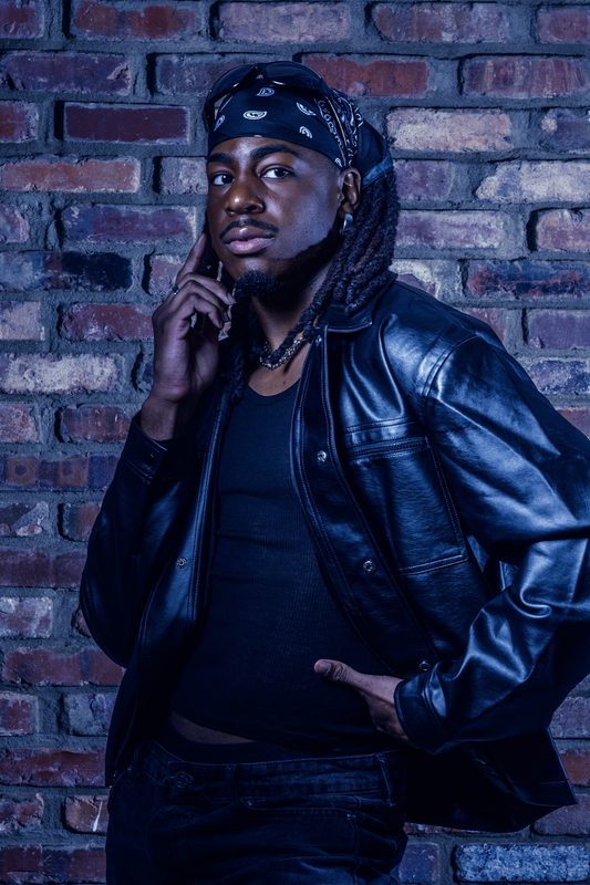 Model from The UGA Agency in leather, moody studio light